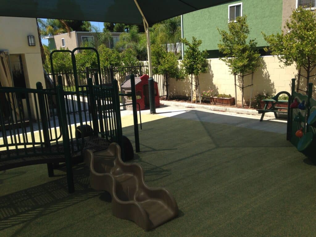 Covered play area under shade structures